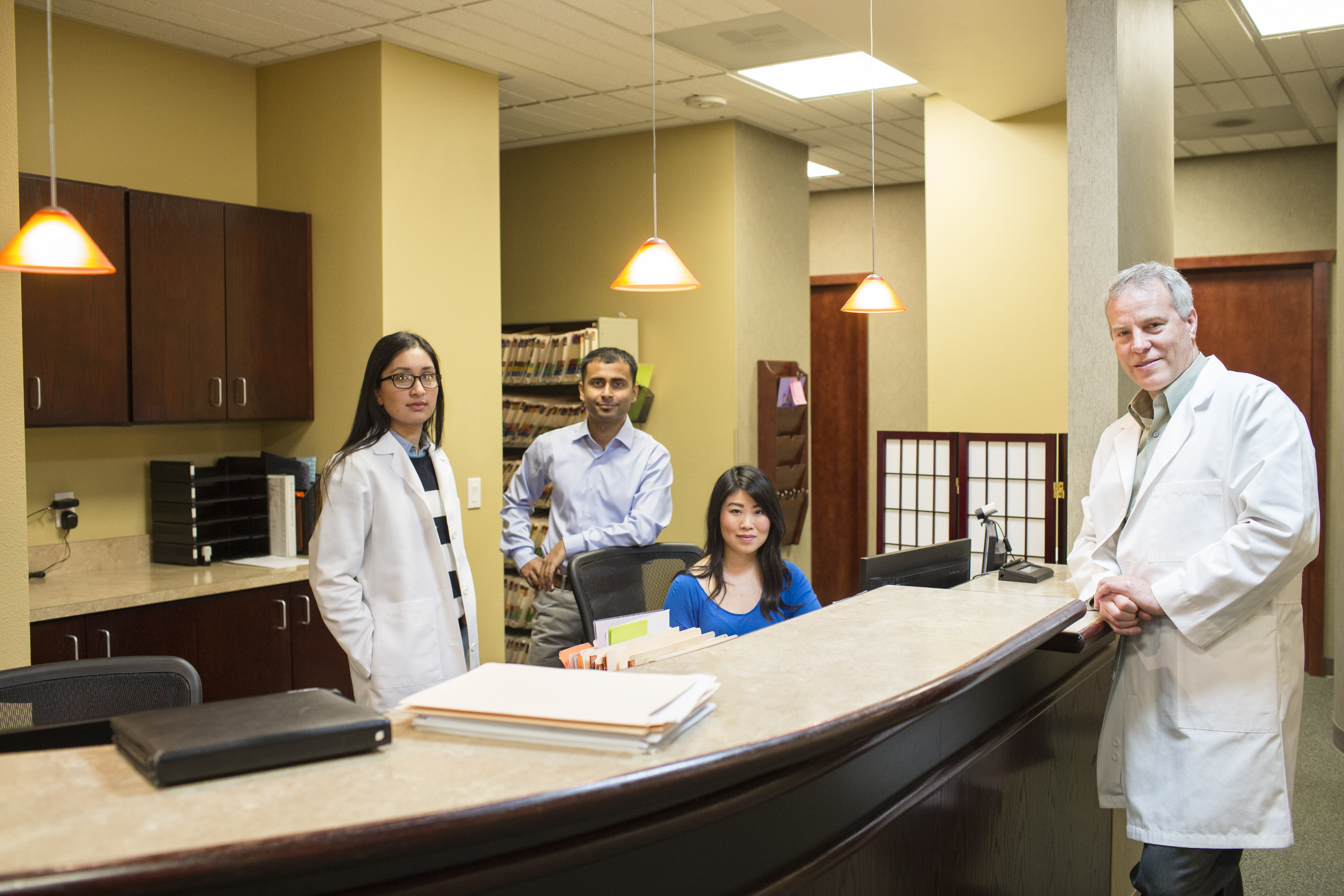 medical staff at the front desk of a medical office